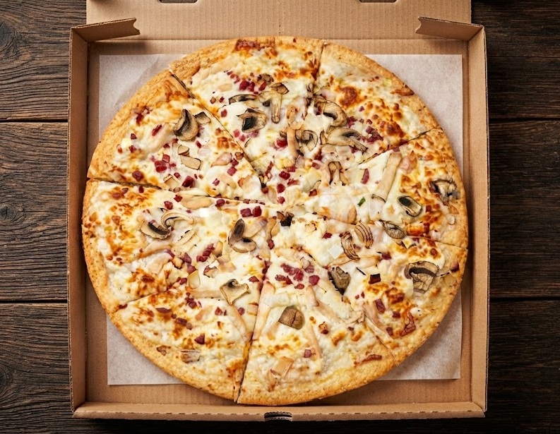 Chicken bacon alfredo pizza with creamy white sauce, grilled chicken and bacon at Ringers Original Pizza Betts Ave Saskatoon